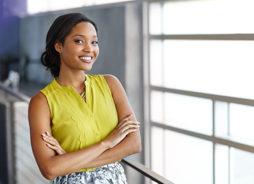 Portrait of a confident black businesswoman at work in her glass office